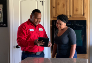 Advanced Home Services technician and customer