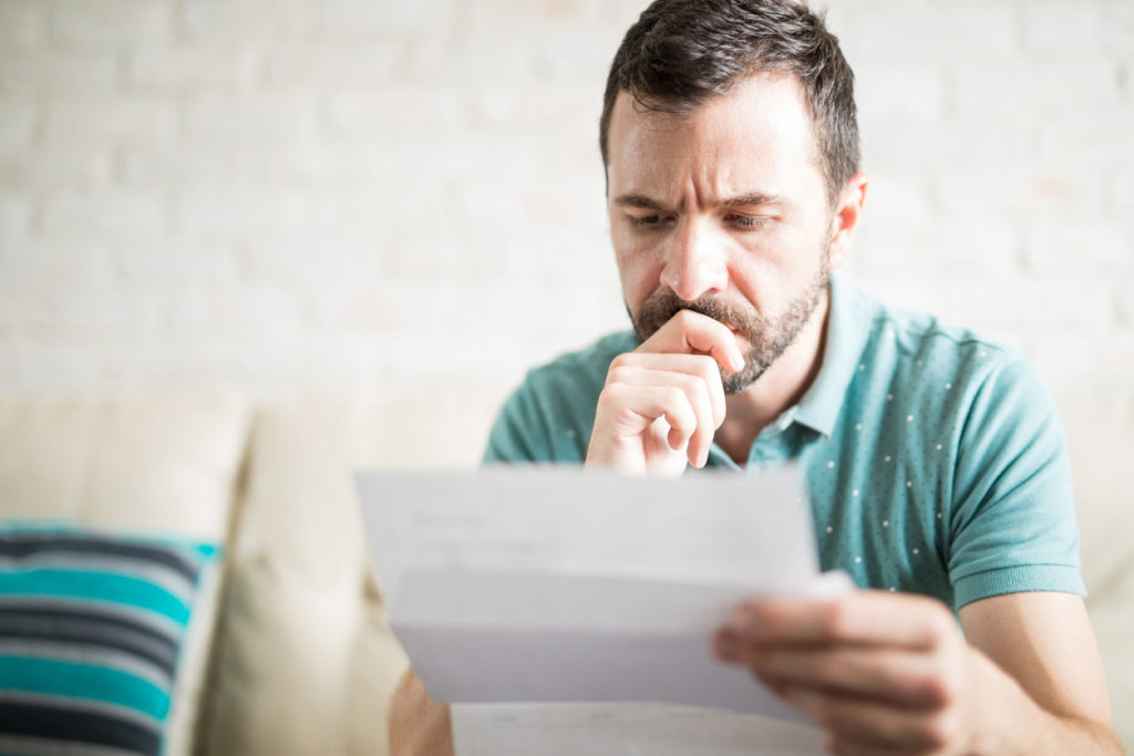 man studying energy bill